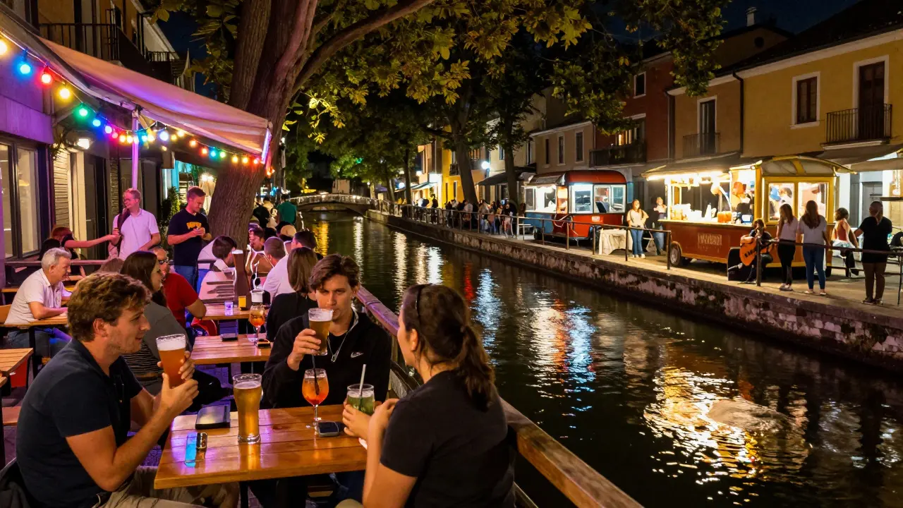 Colorful Navigli canal at night with string lights, people drinking craft beer, and a street musician playing acoustic music.